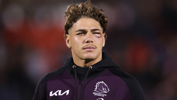 Reece Walsh of the Broncos looks on after being ruled out of his side's clash with the Panthers.