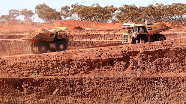 Ore trucks operate out of the stage one pit at the Gruyere Gold Mine 