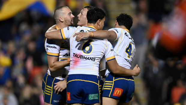 The Eels celebrating a try to Clint Gutherson against the Panthers.