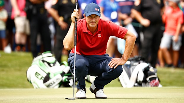 Adam Scott prepares to putt during  a six-way sudden-death playoff, during the final round of the Wyndham Championship.