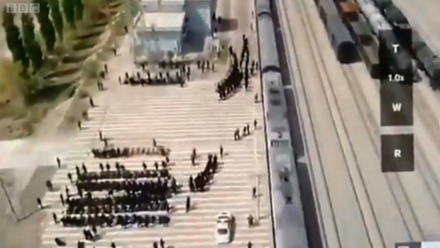 Drone footage of hundreds of blindfolded and shackled men, who appeared to be Uighur and other minority ethnic groups was shown to China's ambassador to the UK 