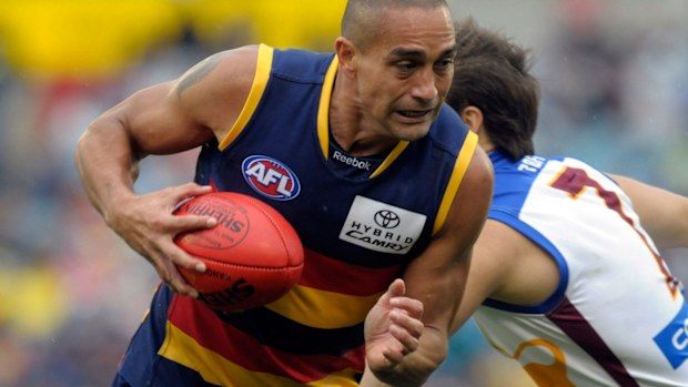 Andrew McLeod breaks tackle in 2010.