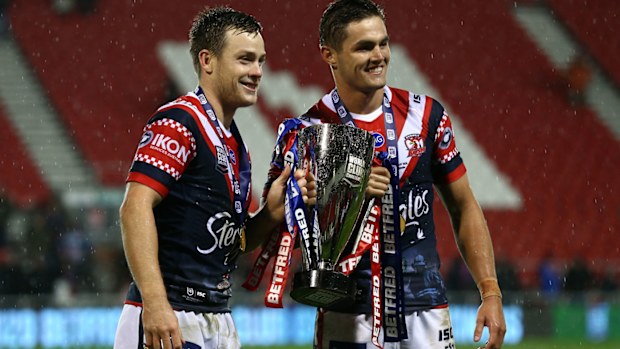 Kyle Flanagan poses with the World Club Challenge trophy with Luke Keary