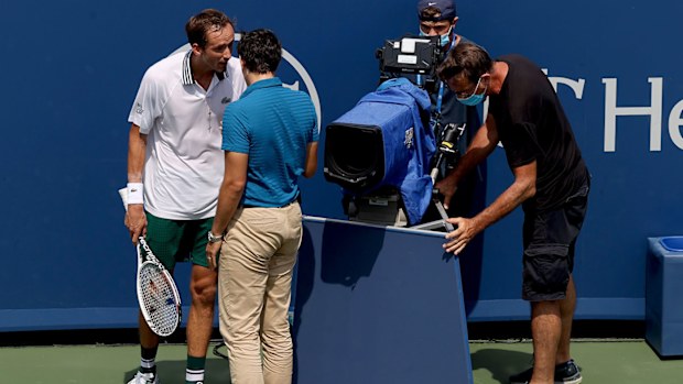 Daniil Medvedev of Russia speaks to chair umpire Nacho Forcadell after colliding with a television camera in his match against Andrey Rublev of Russia during the semifinals of the Western & Southern Open at Lindner Family Tennis Center on August 21, 2021 in Mason, Ohio. (Photo by Matthew Stockman/Getty Images)