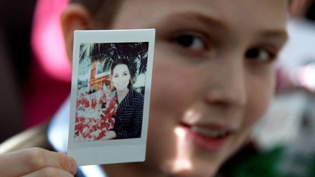 Luke Wheeler-Waddison, 10, takes a polaroid of Catherine, Duchess of Cambridge during a workshop run by the National Portrait Gallery's Hospital Programme at Evelina Children's Hospital on January 28, 2020 in London, England