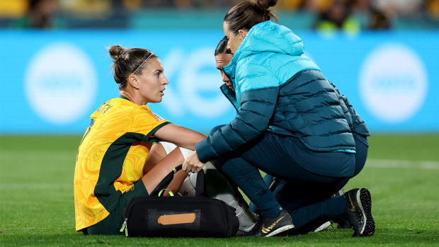 Steph Catley receives medical attention during the FIFA Women's World Cup Australia & New Zealand 2023 round of 16 match between Australia and Denmark at Stadium Australia.