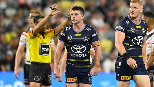 Griffin Neame (right) is sent to the sin bin during North Queensland's loss to the Roosters.