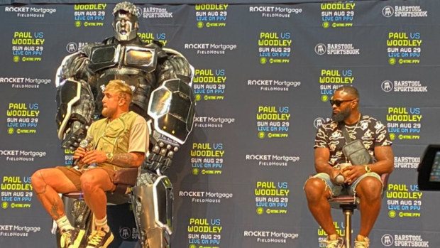 Jake Paul was accompanied by a giant robot chair as he fronted media at his press conference.