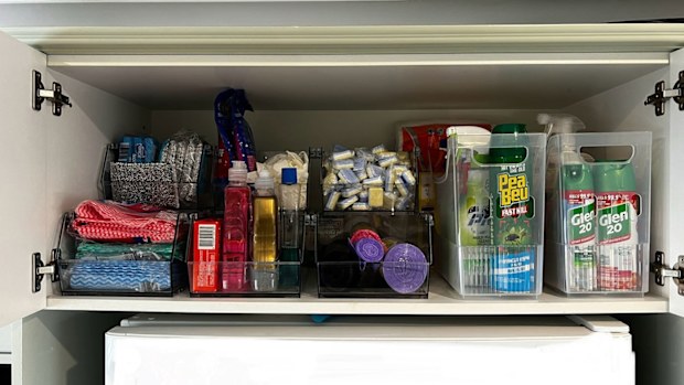 A Kmart shopper has used the narrow fridge organisers to store cleaning products