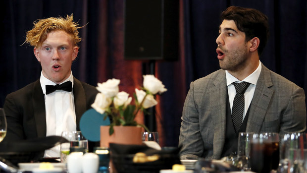 Clayton Oliver of the Demons and Christian Petracca of the Demons react during the 2021 Brownlow Medal Count at Optus Stadium on September 19, 2021 in Perth, Australia. (Photo by Dylan Burns/AFL Photos via Getty Images)
