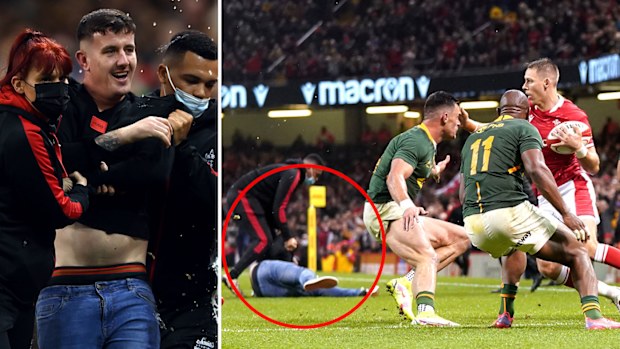 A fan invades the pitch as Wales' Liam Williams is tackled during the Autumn Internationals match at Principality Stadium, Cardiff