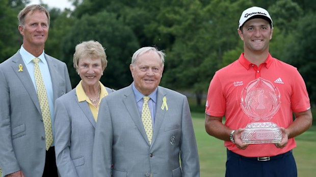 Jon Rahm of Spain celebrates with the winner's trophy, Jack Nicklaus, Barbara Nicklaus and Jack Nicklaus II after winning in the final round of The Memorial Tournament 