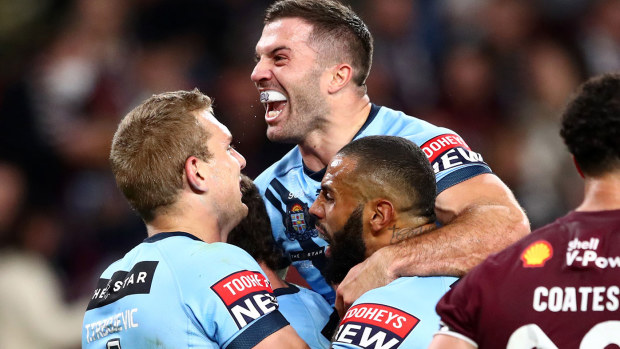 James Tedesco celebrating with teammates 