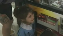 A little girl had her hand stuck in a vending machine before her father rescued her.