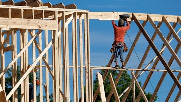 A carpenter builds a home