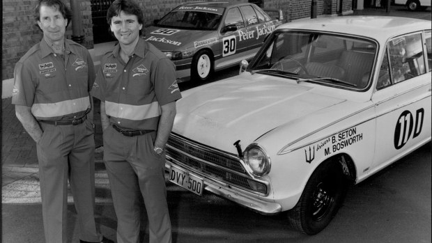 Glenn Seton with his father Bo in 1995, along with Bo's 1965 Bathurst winning car and Glenn's 1995 car.