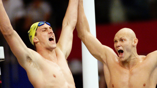 Chris Fydler and Michael Klim celebrate after Australia won the 4x100m freestyle relay.