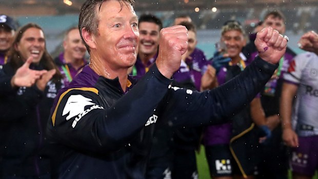 Craig Bellamy celebrates Melbourne's premiership win over Penrith.
