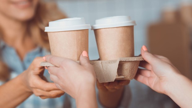 Woman buying takeaway coffee