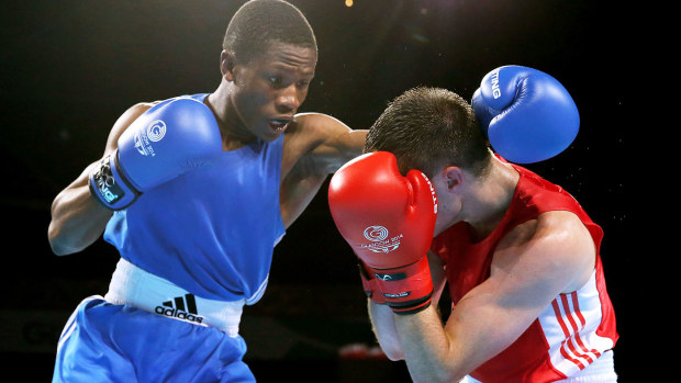 Junias fighting Scotland's Josh Taylor. (Getty)