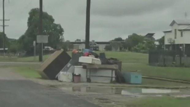 Streets in Ingham are lined with stacks of what folks here couldn't save, from water-logged whitegoods to muddied mattresses.
