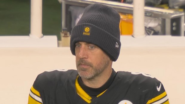 Aaron Rodgers, benched in the fourth quarter.