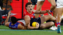 Jake Lever reacts after he was tackled by Charlie Cameron. 