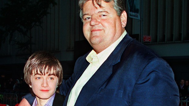 Daniel Radcliffe, left, who plays Harry Potter in the new movie "Harry Potter and the Sorcerer's Stone," and Robbie Coltrane, who plays Hagrid in the film, arrive for the film's New York premiere on Nov. 11, 2001. 