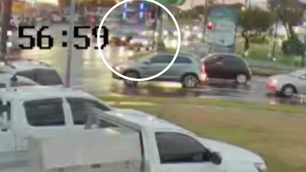 Security video shows the cars pulled up at the intersection of the Hume Highway and Cabramatta Road. 