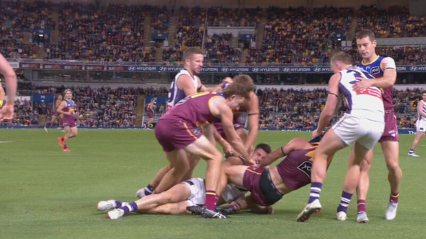 Lions and Dockers players brawl in the third quarter. 