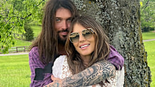 Elizabeth Hurley and Billy Ray Cyrus pose for new photos after confirming their unlikely romance