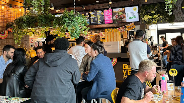 Customers in a Guzman y Gomez store.