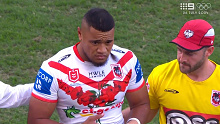 Moses Suli is assisted from the field after being knocked out against the Roosters.