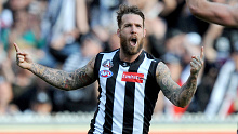 Dane Swan of Collingwood celebrates after he kicked a goal, during the Round 6 AFL match between the Collingwood Magpies and the Essendon Bombers at the MCG in Melbourne, Friday, April 25, 2014. (AAP Image/Joe Castro) NO ARCHIVING, EDITORIAL USE ONLY