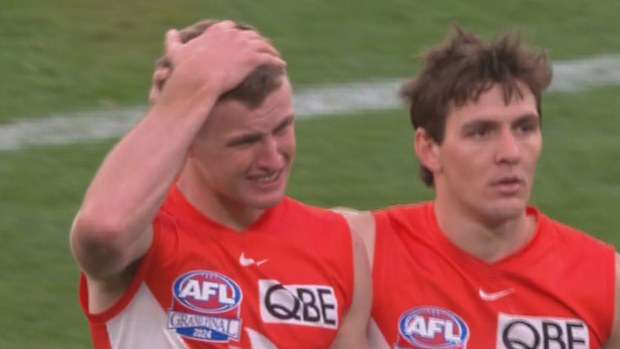 Chad Warner is comforted by Errol Gulden after the Swans suffered another disappointing grand final loss.
