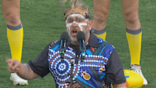 Shannon Ruska leads the Welcome to Country ahead of the AFL preliminary final between the Brisbane Lions and the Carlton Blues.