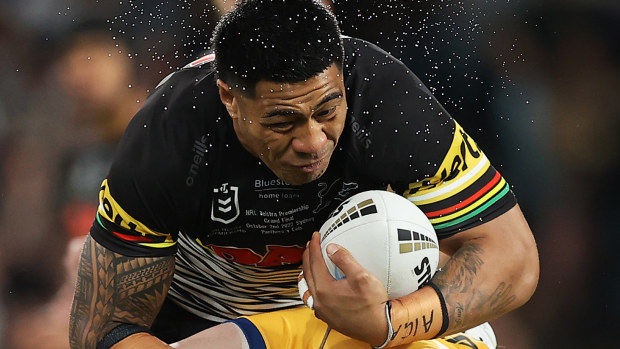 Moses Leota of the Panthers is tackled during the 2022 NRL grand final.