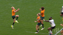 Wallabies players Mark Nawaqanitawase and Carter Jordon both jump, but don't commit, to take the ball.
