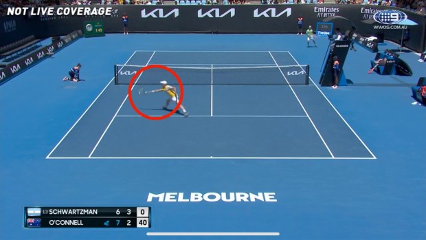 Chris O'Connell brushes the ball with his racquet.