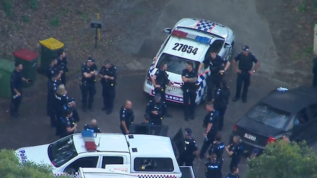 Two people are in custody after a large-scale police response to shots reportedly fired on a busy highway north of Brisbane. 