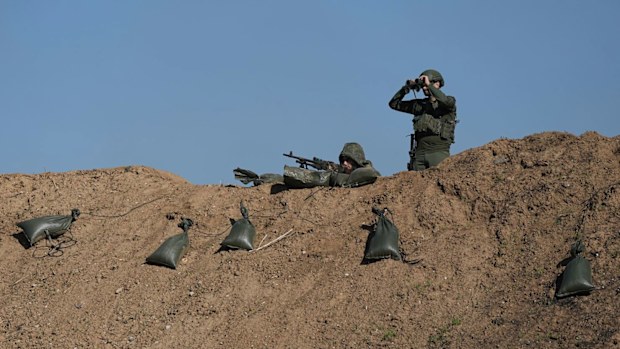 Israeli soldiers are seen near the border with the Gaza Strip, southern Israel, Thursday, Nov. 30, 2023. during a temporary cease-fire between Israel and Hamas.