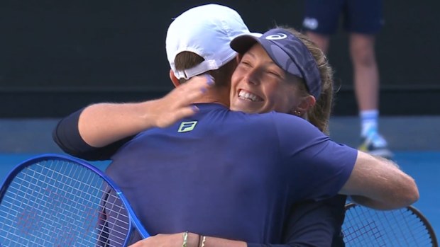 Mixed doubles pair Olivia Gadecki and John Peers embrace after advancing to the final at the Australian Open.