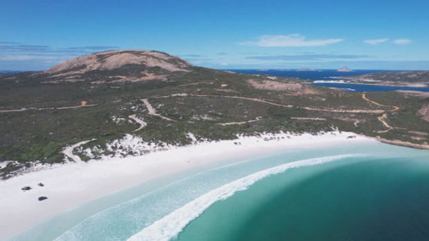 A Melbourne surfer is presumed dead after he was attacked by a shark in front of his girlfriend and helpless onlookers at a popular beach in Western Australia.
