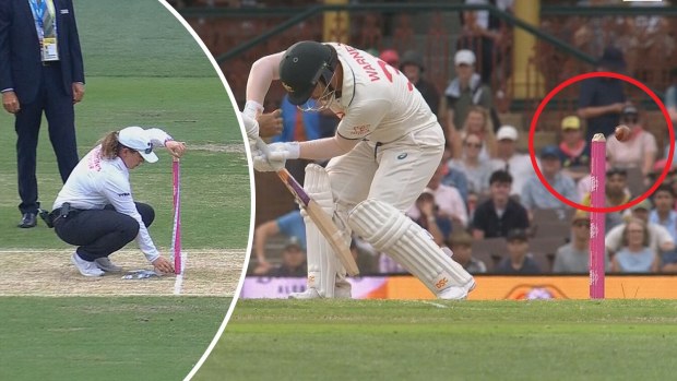 A match official measures the stumps after David Warner survived a scare.