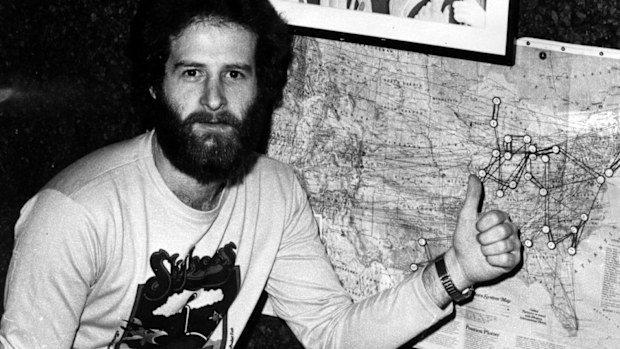 Michael Gudinski points to a map showing one of his first signings, the Skyhooks', tour of America.