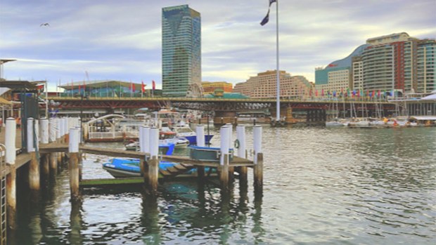 A man's body was found by police divers in Darling Harbour near King St Wharf.