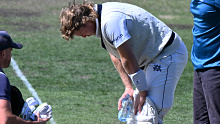 Will Pucovski of the Bushrangers is checked by medical staff after being struck by a delivery from Riley Meredith.