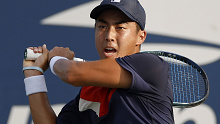 NEW YORK, NEW YORK - AUGUST 30: Rinky Hijikata of Australia returns a shot against Marton Fucsovics of Hungary during their Men's Singles Second Round match on Day Three of the 2023 US Open at the USTA Billie Jean King National Tennis Center on August 30, 2023 in the Flushing neighborhood of the Queens borough of New York City. (Photo by Sarah Stier/Getty Images)