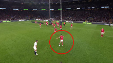 Rio Dyer and Elliot Dee rush at George Ford's kicking tee after the England fly-half stepped, allowing the Welsh players an chance to knock the ball over.