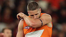Jesse Hogan kissed his black arm band as a tribute to McCarthy, who he played with at Fremantle.